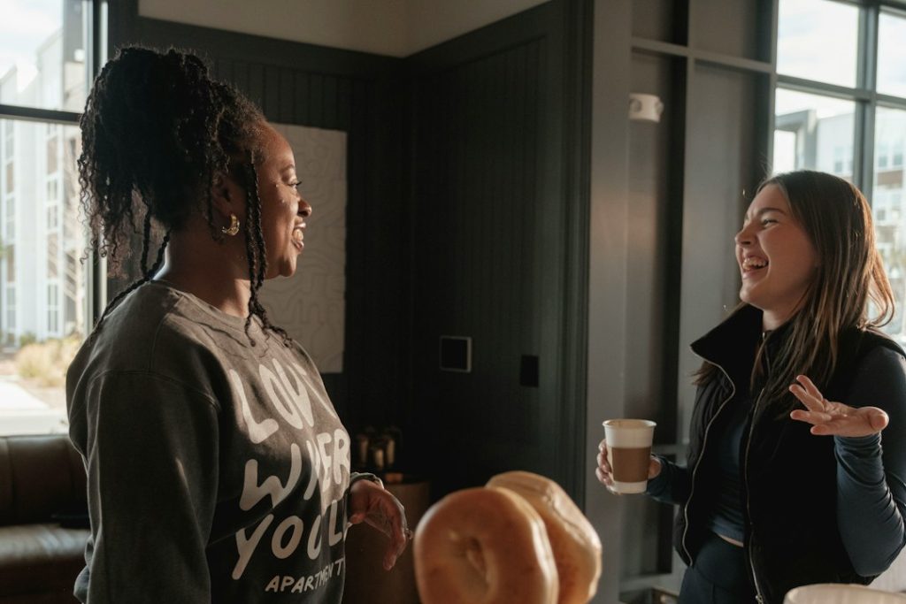 Mature neighbors sharing conversation and connection over coffee